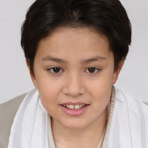 Joyful white child female with short  brown hair and brown eyes