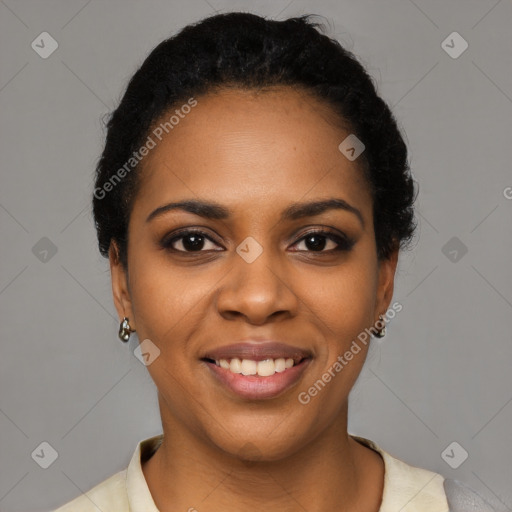 Joyful black young-adult female with short  black hair and brown eyes