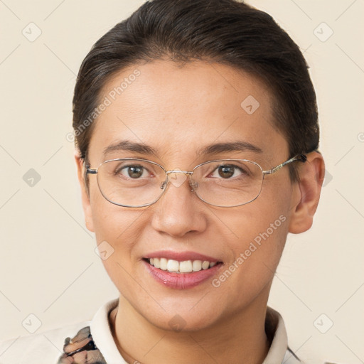 Joyful white adult female with short  brown hair and brown eyes