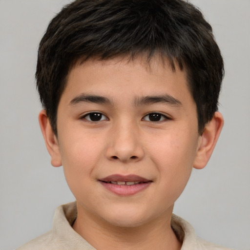 Joyful white child male with short  brown hair and brown eyes