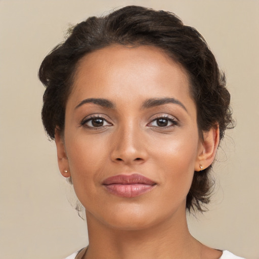 Joyful latino young-adult female with short  brown hair and brown eyes