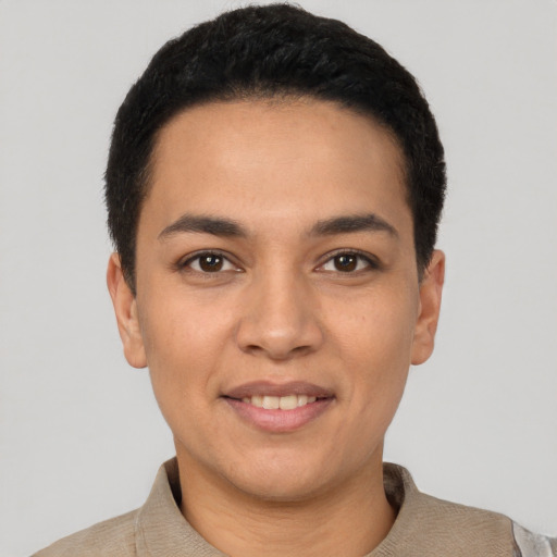 Joyful latino young-adult male with short  black hair and brown eyes
