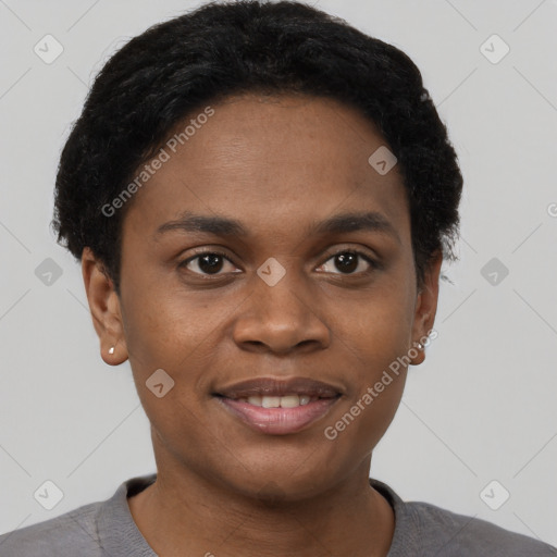 Joyful black young-adult female with short  black hair and brown eyes