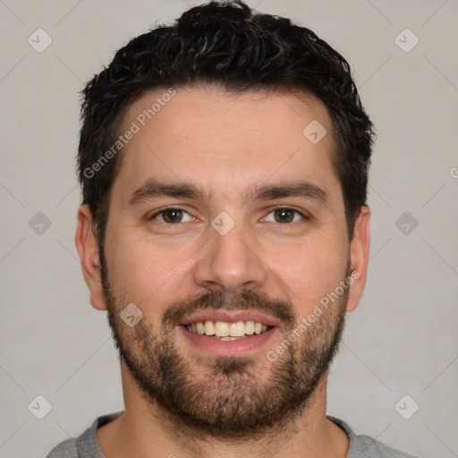 Joyful white young-adult male with short  black hair and brown eyes