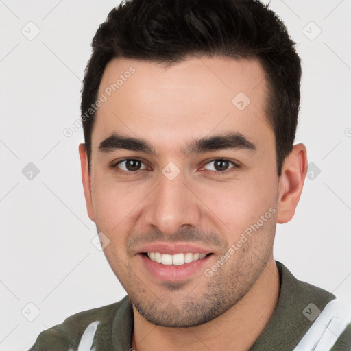 Joyful white young-adult male with short  brown hair and brown eyes