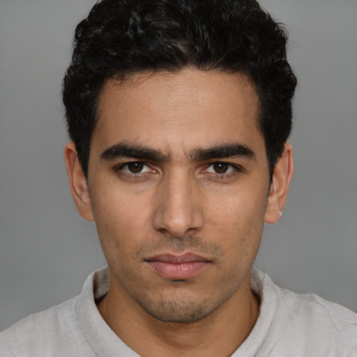 Neutral white young-adult male with short  black hair and brown eyes
