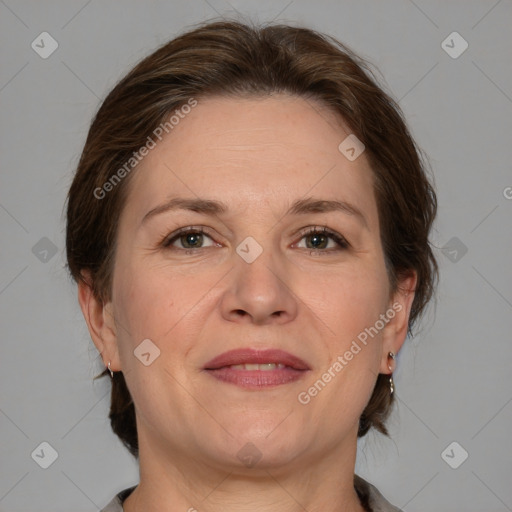 Joyful white adult female with medium  brown hair and grey eyes