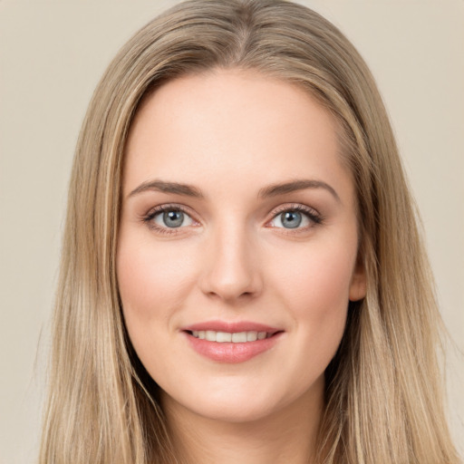 Joyful white young-adult female with long  brown hair and green eyes