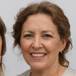 Joyful white middle-aged female with medium  brown hair and brown eyes