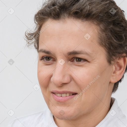 Joyful white adult female with short  brown hair and brown eyes