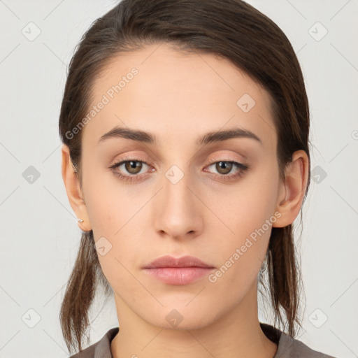 Neutral white young-adult female with long  brown hair and brown eyes