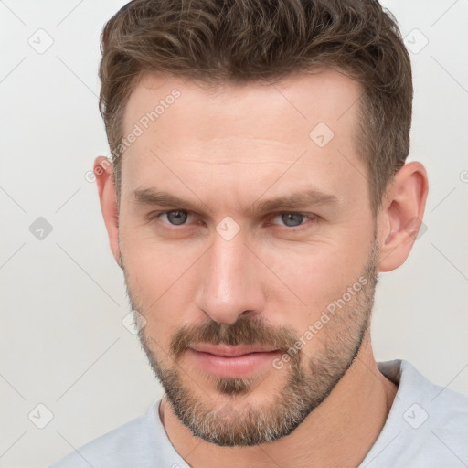 Neutral white young-adult male with short  brown hair and grey eyes