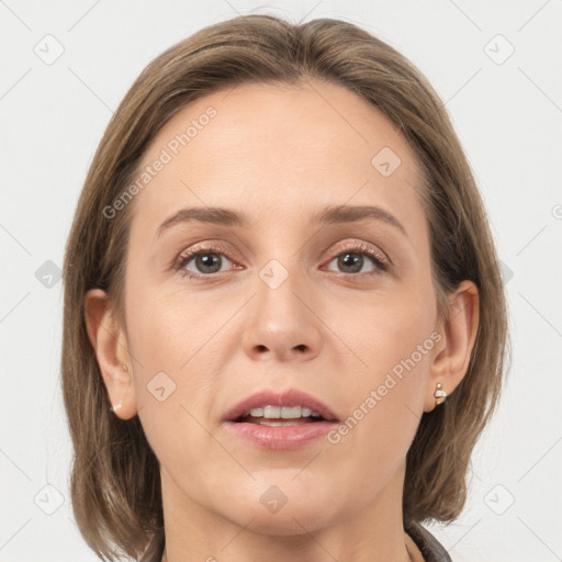 Joyful white adult female with medium  brown hair and grey eyes