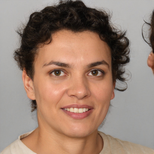 Joyful white young-adult female with short  brown hair and brown eyes