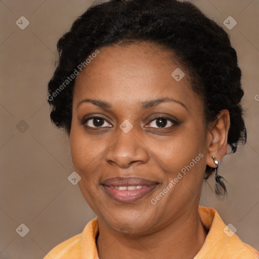 Joyful black adult female with short  brown hair and brown eyes