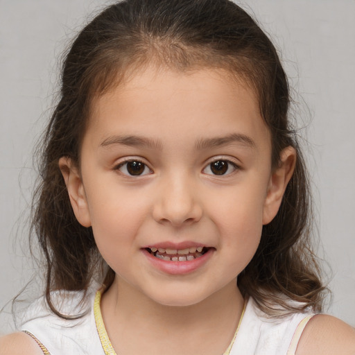 Joyful white child female with medium  brown hair and brown eyes