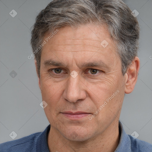 Joyful white middle-aged male with short  brown hair and brown eyes