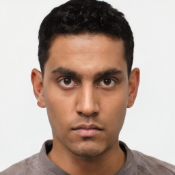 Neutral latino young-adult male with short  black hair and brown eyes