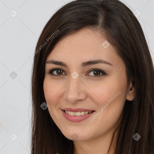 Joyful white young-adult female with long  brown hair and brown eyes