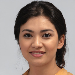 Joyful asian young-adult female with medium  black hair and brown eyes