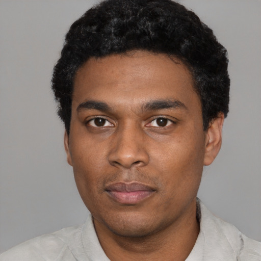 Neutral black young-adult male with short  black hair and brown eyes