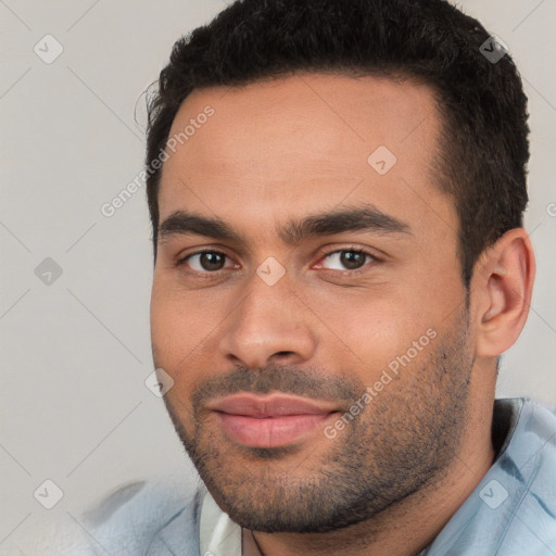 Joyful white young-adult male with short  black hair and brown eyes