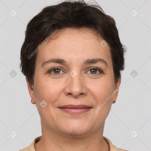 Joyful white adult female with short  brown hair and brown eyes