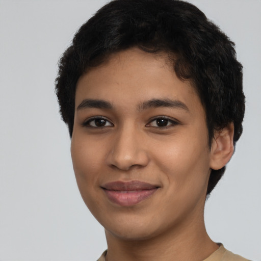 Joyful latino young-adult female with short  black hair and brown eyes