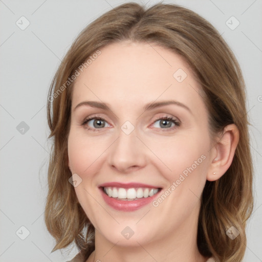 Joyful white young-adult female with medium  brown hair and green eyes