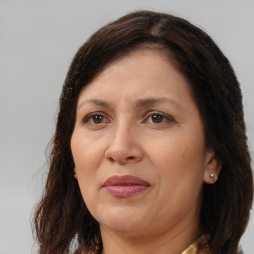 Joyful white adult female with long  brown hair and brown eyes
