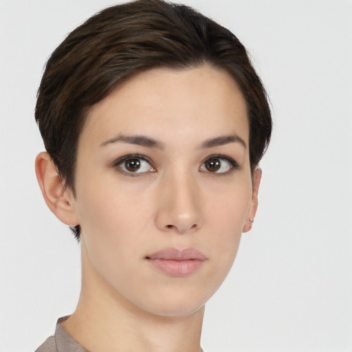 Neutral white young-adult female with short  brown hair and brown eyes