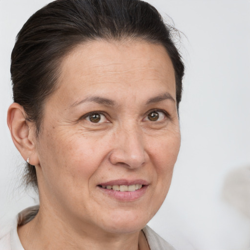 Joyful white adult female with short  brown hair and brown eyes