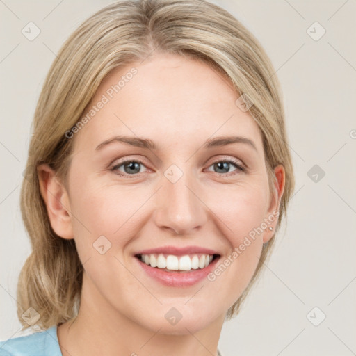 Joyful white young-adult female with medium  brown hair and blue eyes