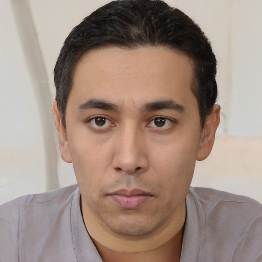 Neutral white young-adult male with short  black hair and brown eyes