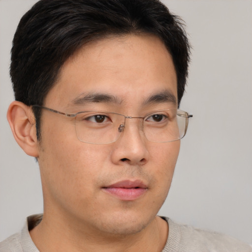 Neutral asian young-adult male with short  brown hair and brown eyes