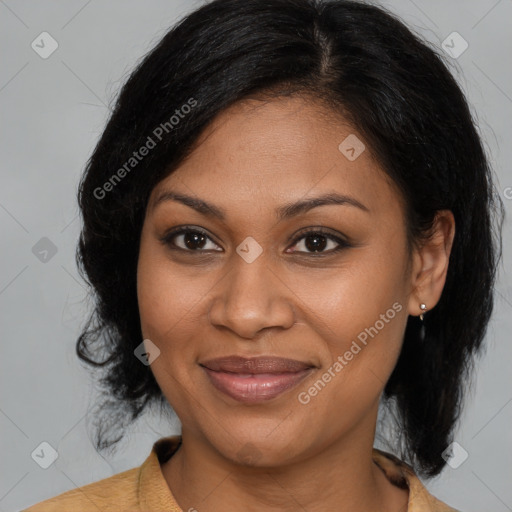 Joyful black young-adult female with medium  brown hair and brown eyes