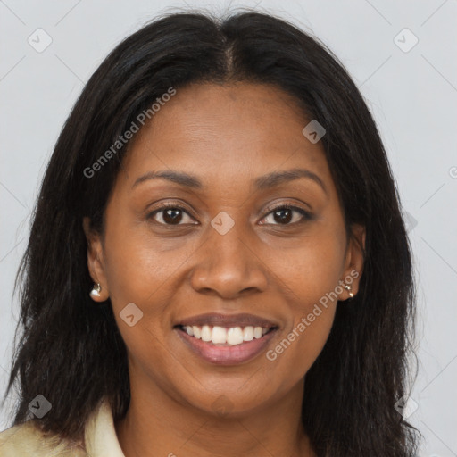 Joyful black young-adult female with long  brown hair and brown eyes