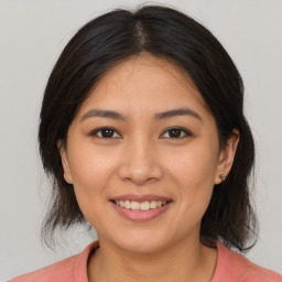 Joyful white young-adult female with medium  brown hair and brown eyes