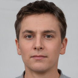 Neutral white young-adult male with short  brown hair and brown eyes