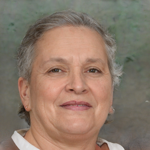 Joyful white middle-aged female with short  gray hair and brown eyes