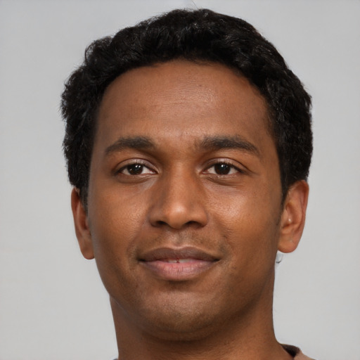 Neutral black young-adult male with short  black hair and brown eyes
