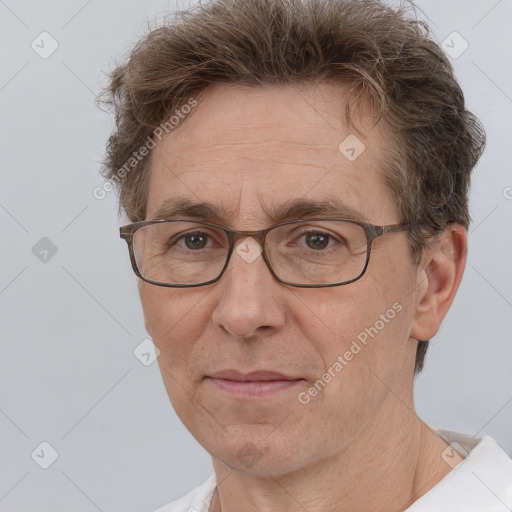 Joyful white middle-aged male with short  brown hair and brown eyes