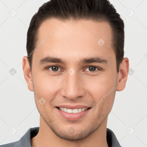 Joyful white young-adult male with short  brown hair and brown eyes