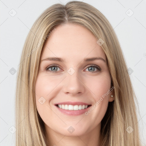 Joyful white young-adult female with long  brown hair and grey eyes