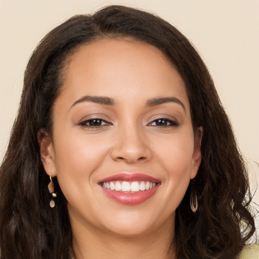 Joyful white young-adult female with long  brown hair and brown eyes