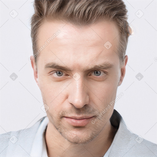 Joyful white adult male with short  brown hair and grey eyes