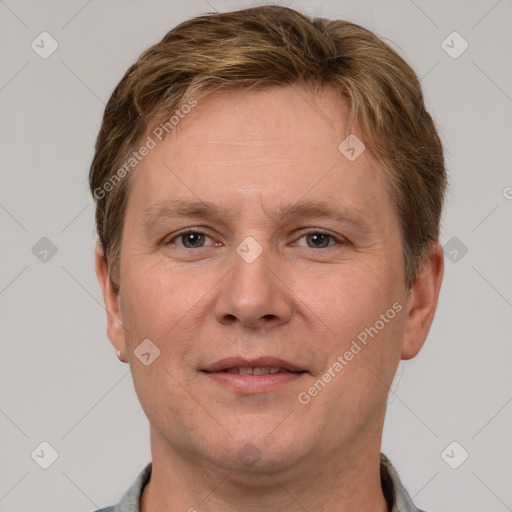 Joyful white adult male with short  brown hair and grey eyes