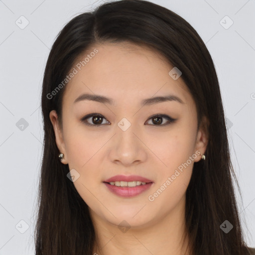 Joyful asian young-adult female with long  brown hair and brown eyes