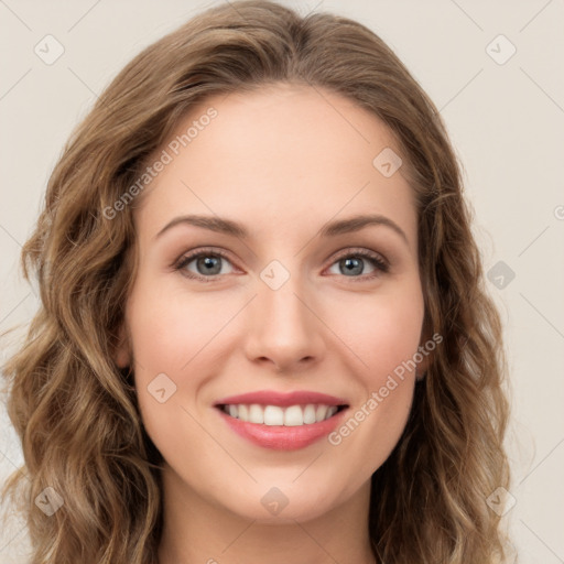 Joyful white young-adult female with long  brown hair and green eyes