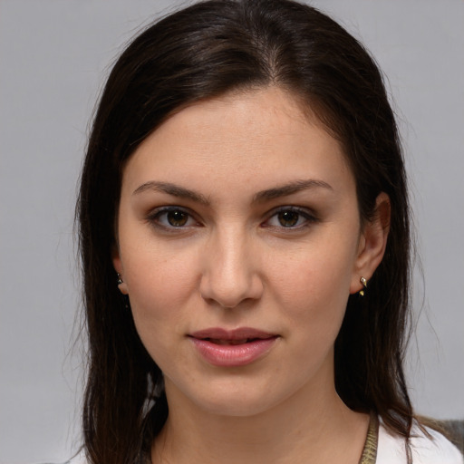 Joyful white young-adult female with medium  brown hair and brown eyes